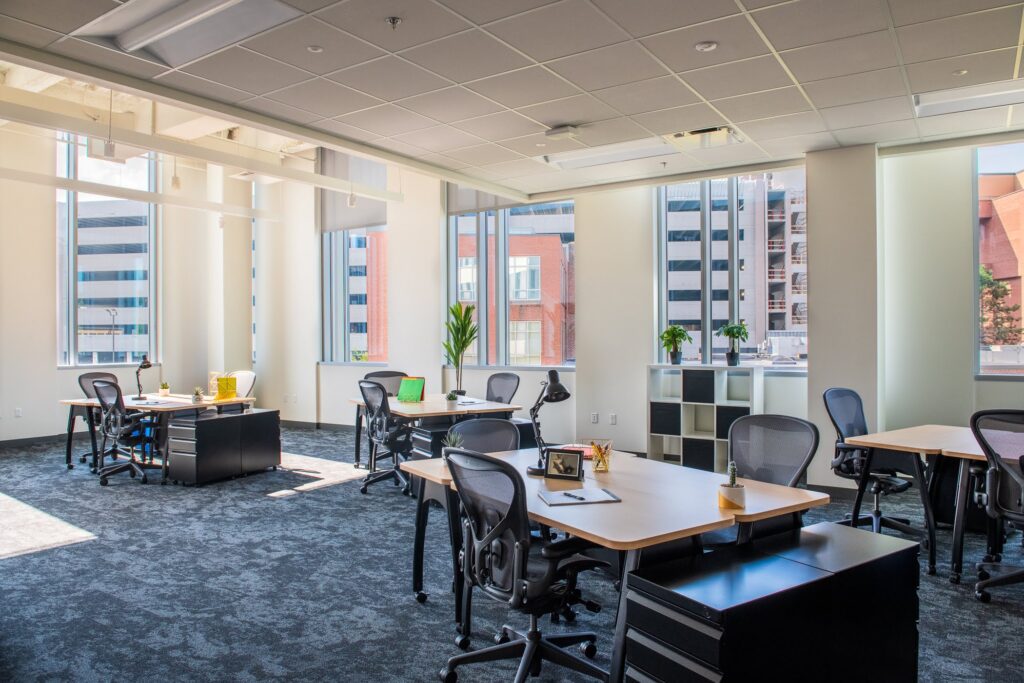 Private office at CIC Providence with large windows and standard CIC furniture.