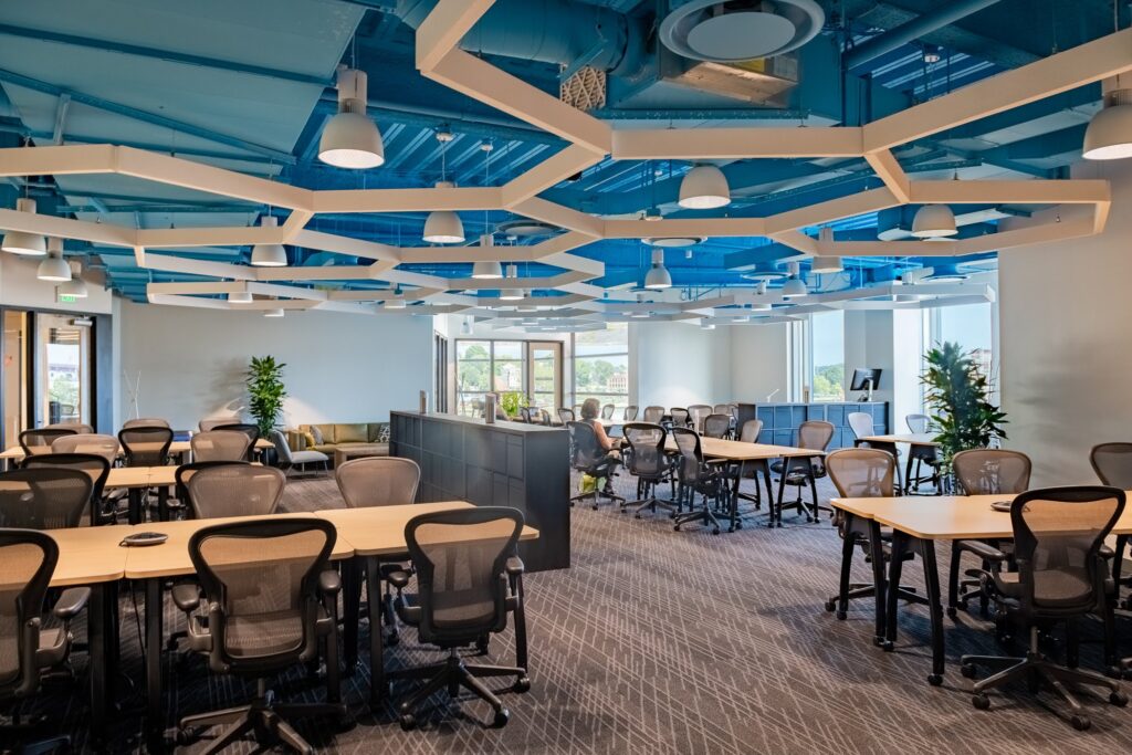 Coworking center at CIC Providence with shared desks and chairs.