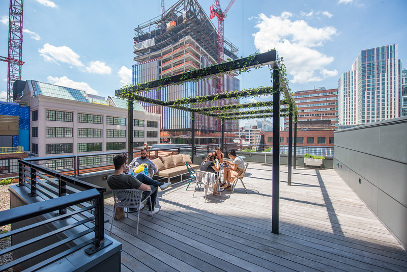 Outdoor terrace at CIC Cambridge with people socializing