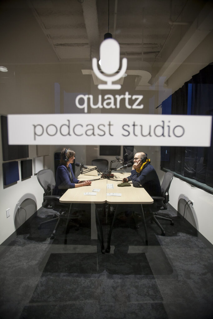 Two people recording a podcast using the equipment available in CIC's podcast studio.