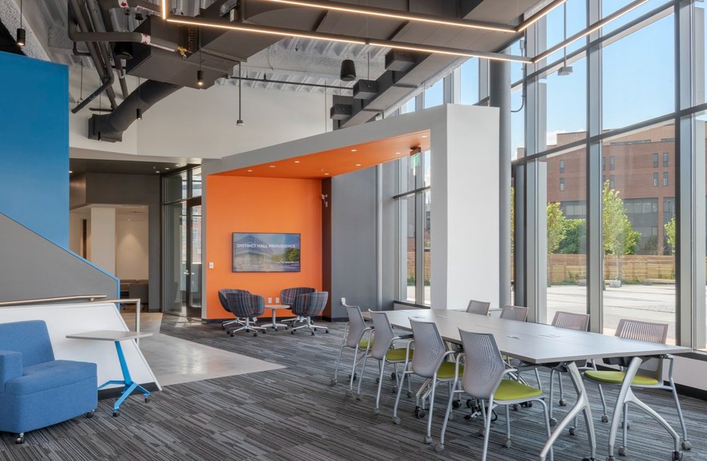 Innovators' lounge event space at CIC  Providence with natural light and mixed seating