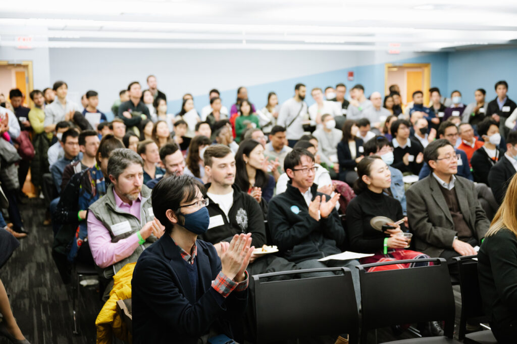 People applauding at a CIC event