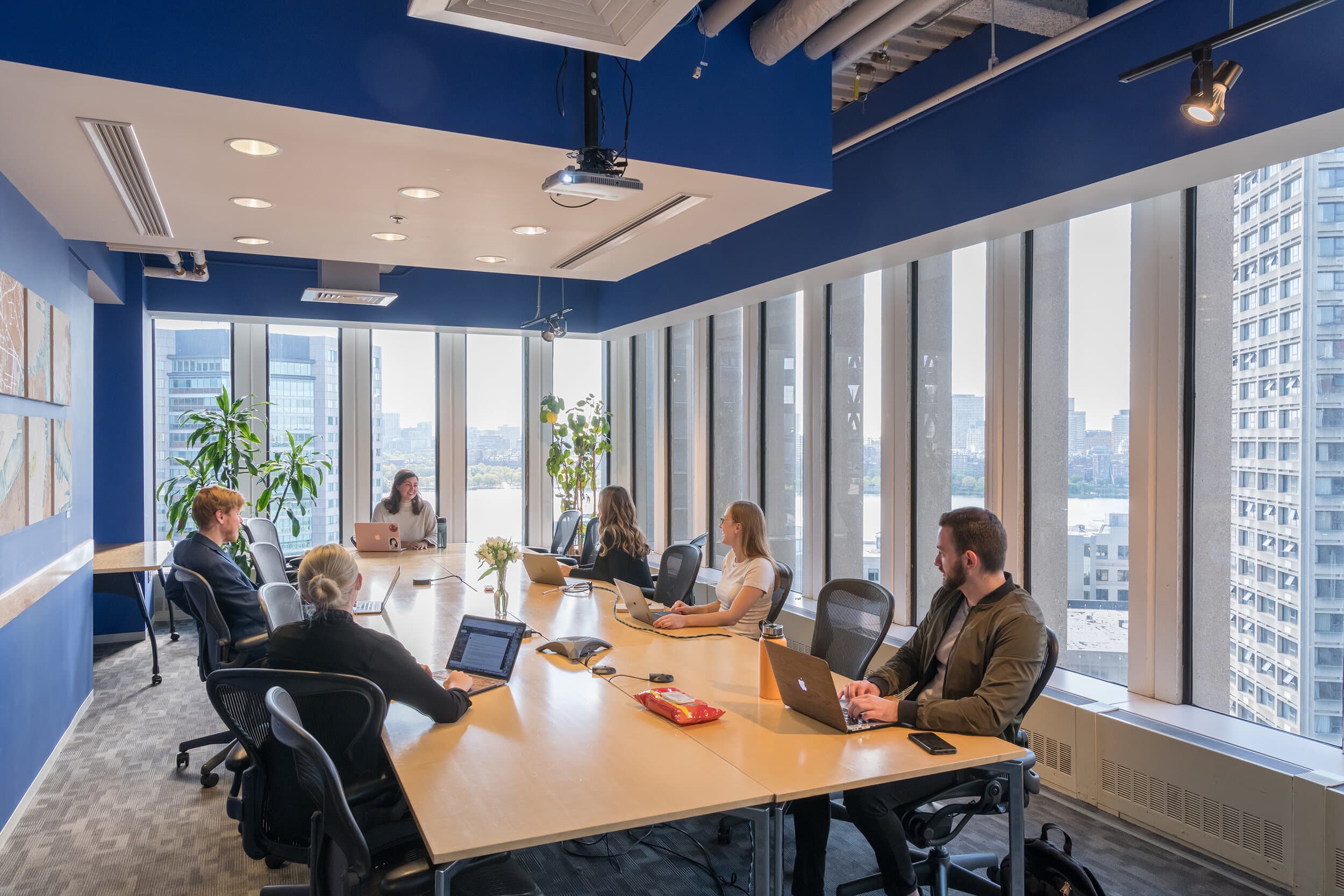 Large window conference room with city and river views