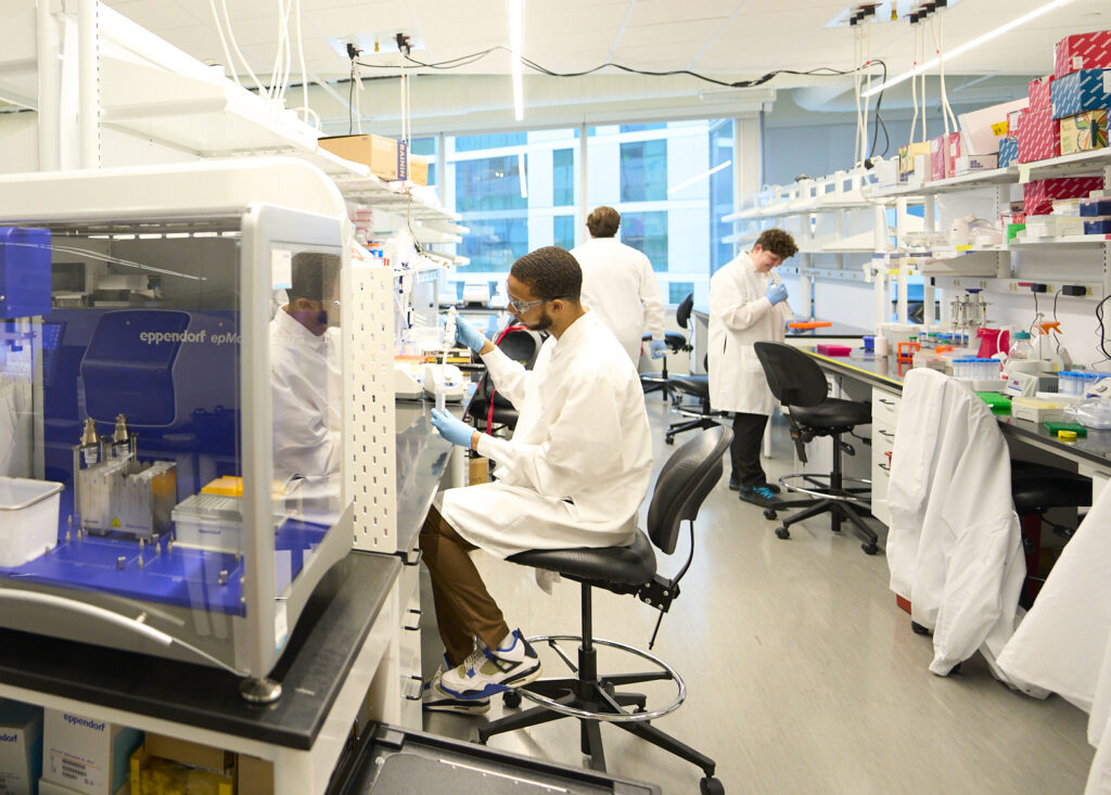 Lab space with three lab technicians working