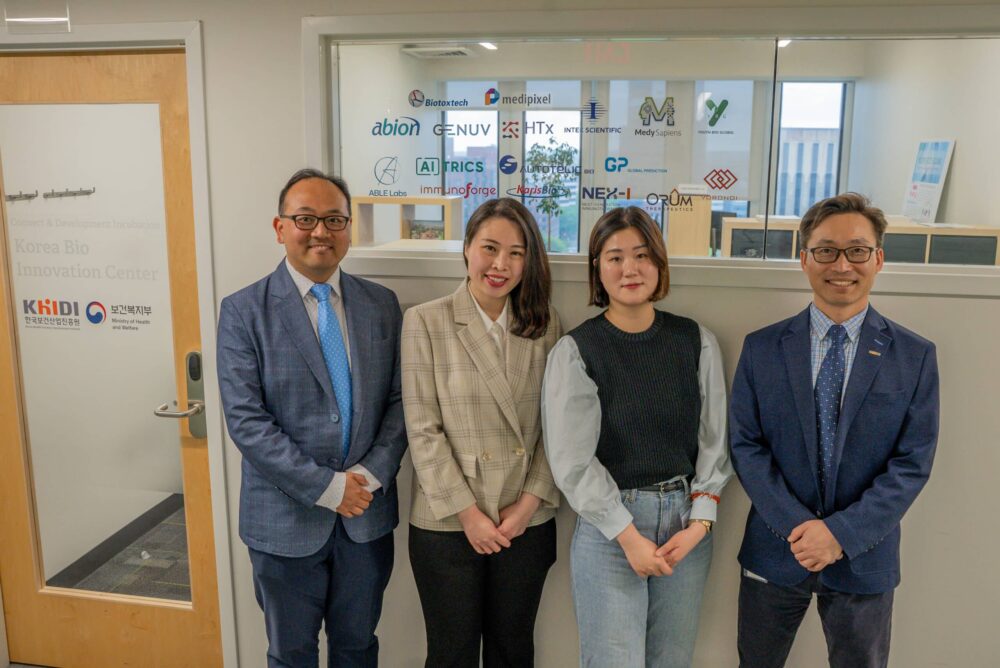 The KHIDI team standing in front of the Korea Bio Innovation Center.