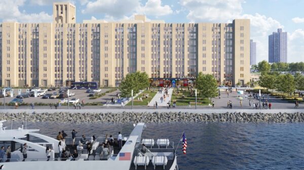 Waterfront view of BATWorks at Brooklyn Army Terminal with people gathering and a ferry docked in the foreground