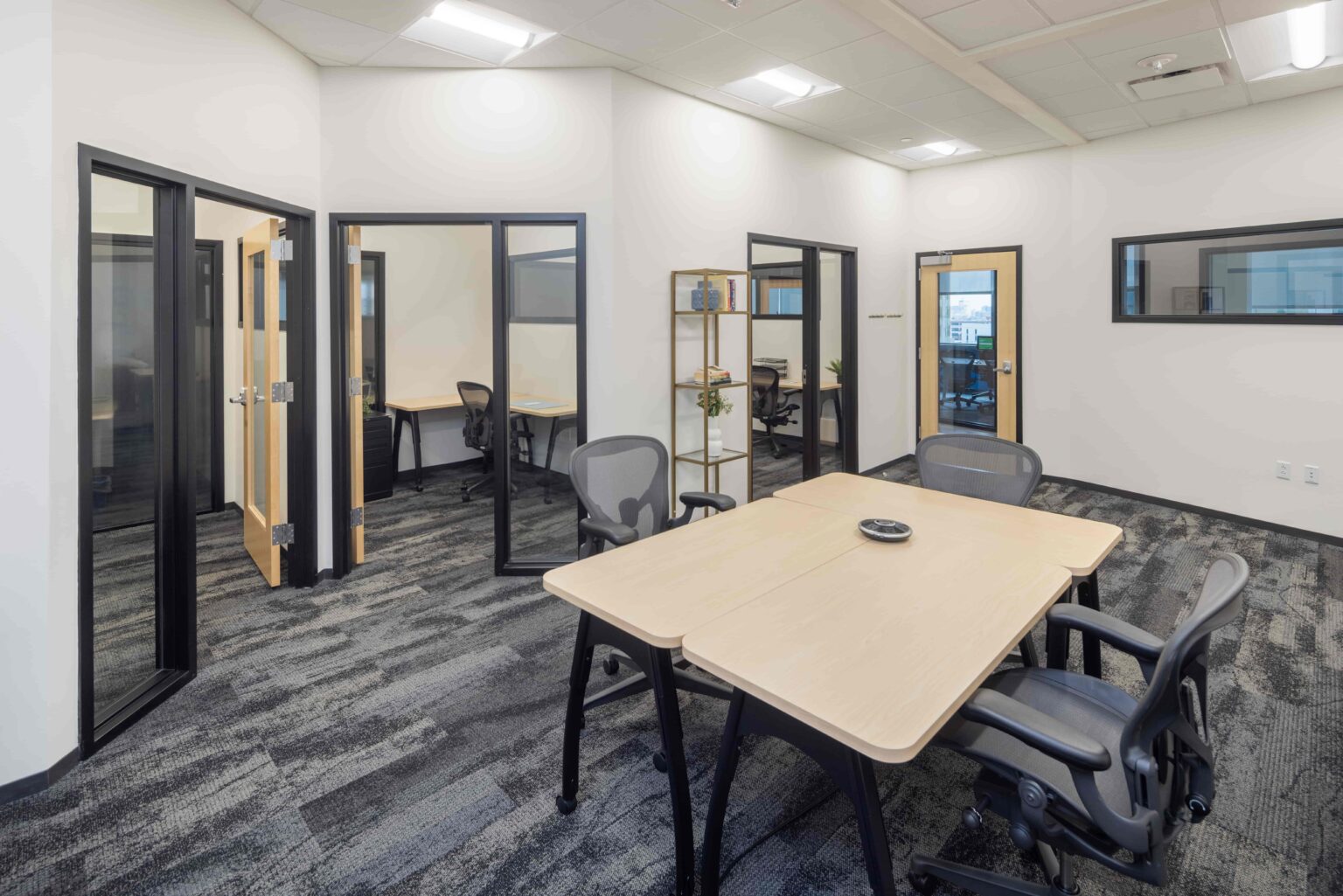 A large interior CIC office suite with standard furniture
