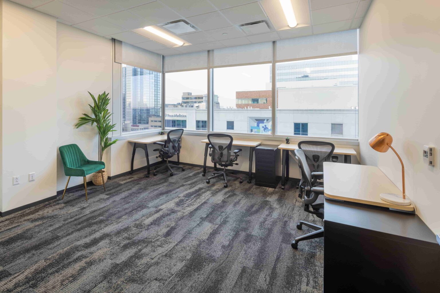 Medium-sized window office at CIC Philadelphia with standard CIC furniture