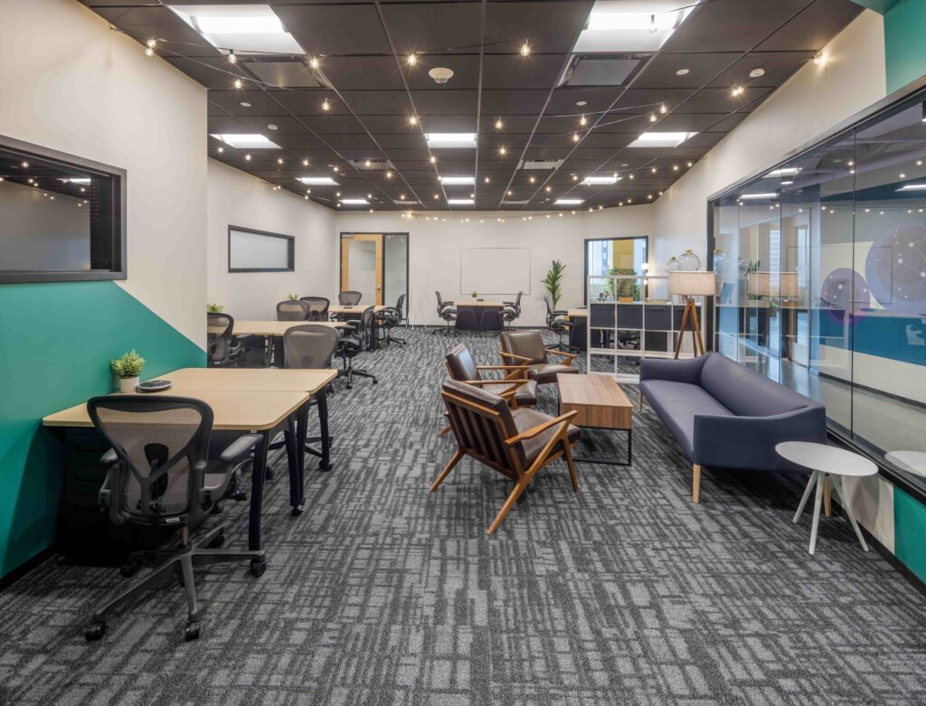 Dedicated desk area with standard CIC furniture and a coffee corner