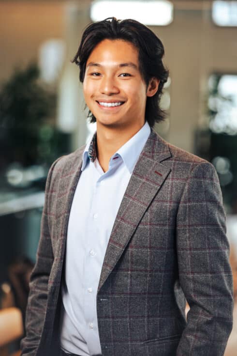 Headshot of founder Jeremy Chow smiling at the camera