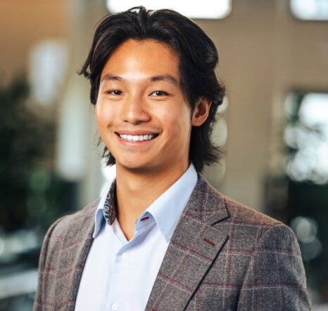 Headshot of founder Jeremy Chow smiling at the camera