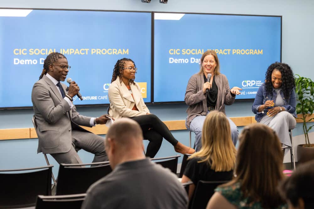 Several members of the CIC Social Impact Program speaking on a panel at their Demo Day