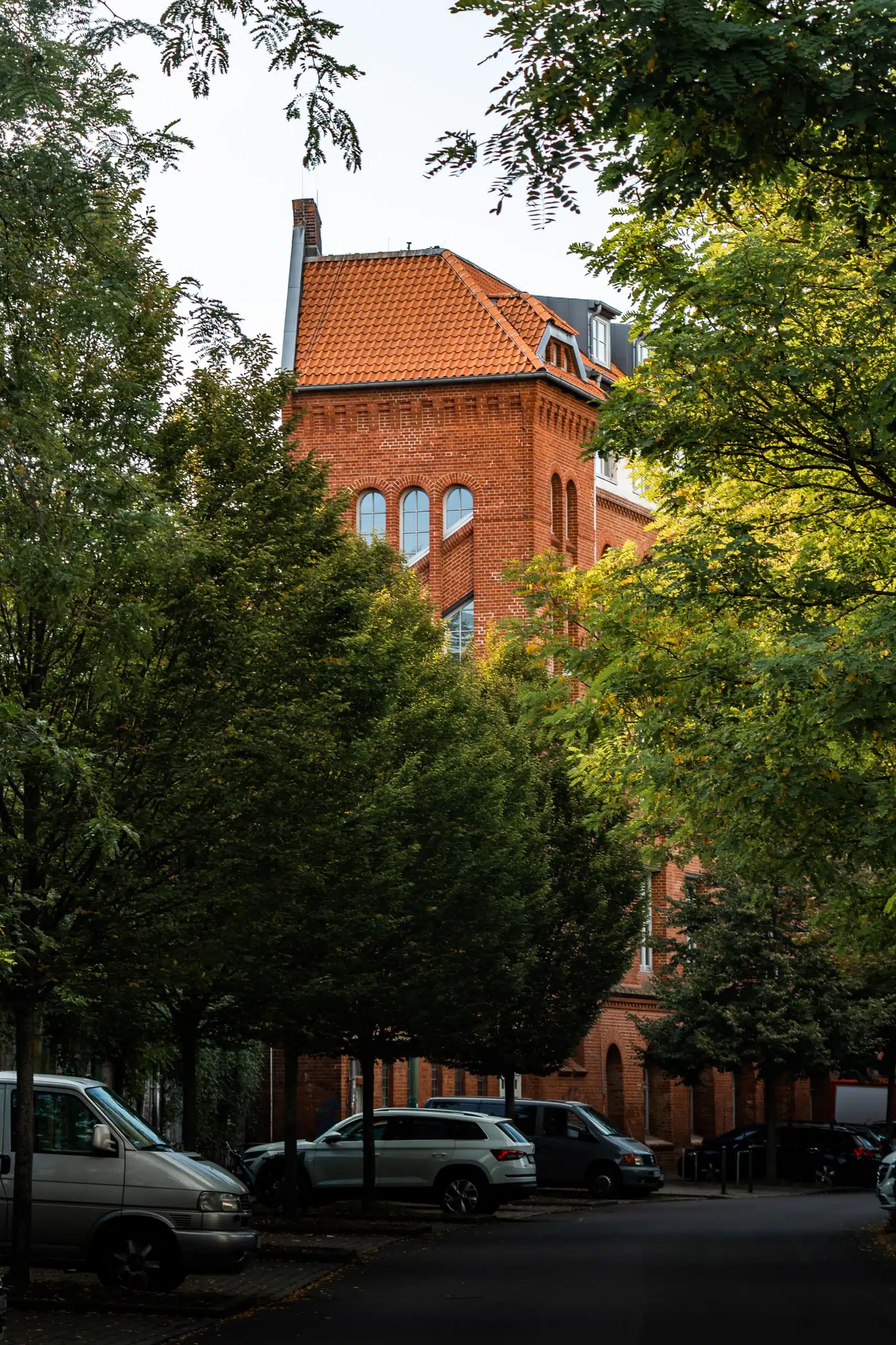 CIC Berlin visible through foliage