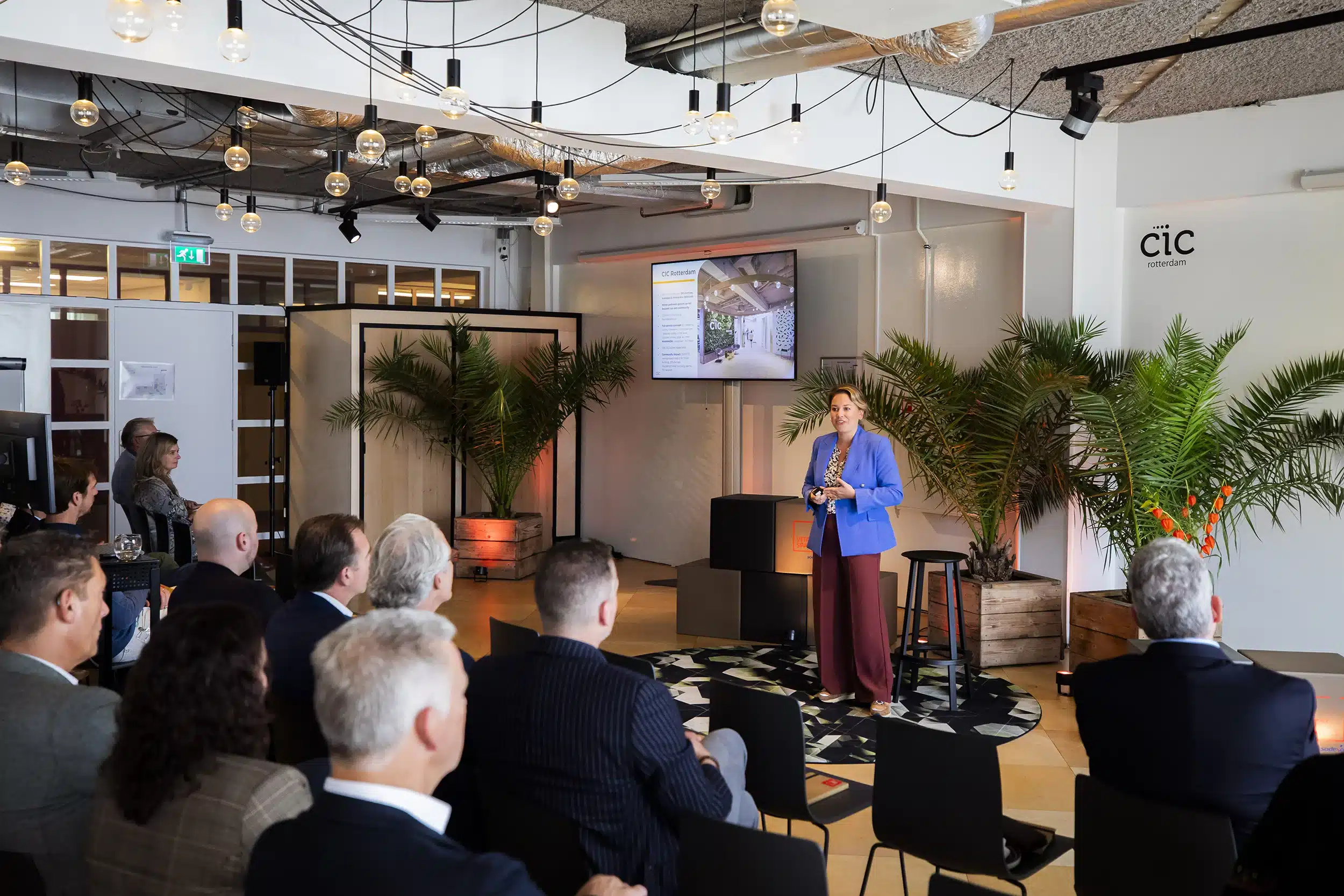 People watch a presenter on stage during an event at CIC Rotterdam