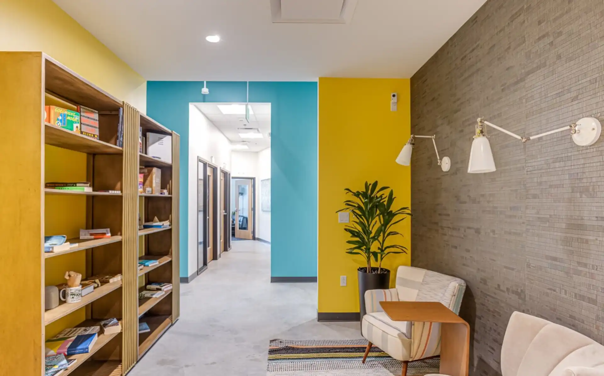 Hallway with green wall and plant decals at CIC Boston