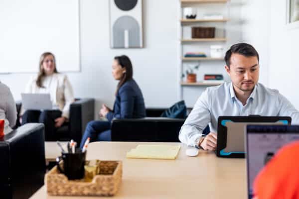 Three people working in an office in CIC St. Louis.