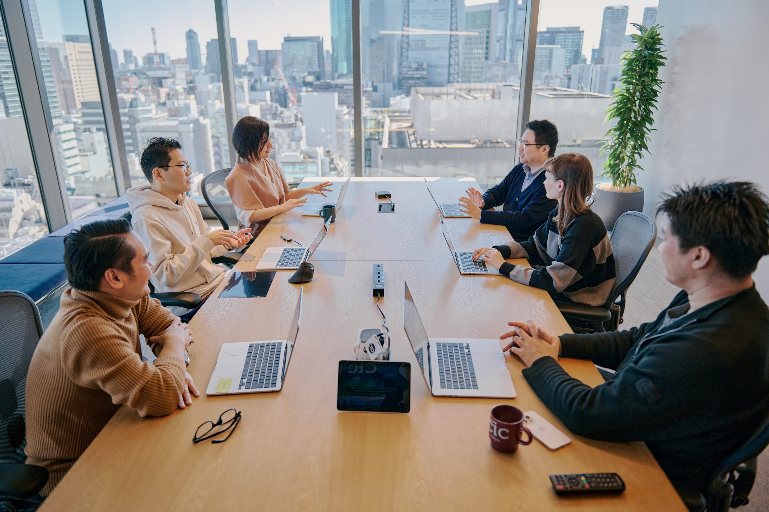 People sitting in a conference space in the CIC Tokhyo building